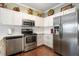 Modern kitchen featuring stainless steel appliances and ample counter space at 8701 Neuse Village Ct, Raleigh, NC 27616