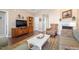 Relaxing living room with a fireplace, TV, and plenty of natural light at 8701 Neuse Village Ct, Raleigh, NC 27616