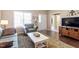 Inviting living room featuring a comfortable seating area and a bright window view at 8701 Neuse Village Ct, Raleigh, NC 27616
