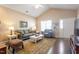 Comfortable living room featuring ample seating, a vaulted ceiling and natural light at 8701 Neuse Village Ct, Raleigh, NC 27616