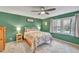 Bedroom featuring a large bed, ceiling fan, and lots of natural light at 1010 Flanders St, Garner, NC 27529
