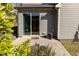 A cozy patio with ample space for entertaining, accessible through a sliding glass door at 1012 Catch Fly Ln, Durham, NC 27713