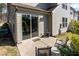 Relaxing back patio with comfortable seating and a convenient sliding glass door entry at 1012 Catch Fly Ln, Durham, NC 27713
