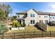 View of the backyard with a fence, grass, and an elevated garden, perfect for relaxing and enjoying the outdoors at 1012 Catch Fly Ln, Durham, NC 27713