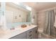 Bright bathroom featuring double sinks, modern fixtures, and a shower-tub combination at 1012 Catch Fly Ln, Durham, NC 27713