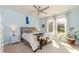 Comfortable bedroom featuring a bed with a fur accent and two large windows offering natural light at 1012 Catch Fly Ln, Durham, NC 27713