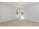 Empty bedroom with carpet, neutral paint, and two windows at 1012 Catch Fly Ln, Durham, NC 27713
