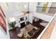 Elevated view of a bright living room featuring soaring ceilings, hardwood floors, fireplace, and stylish furnishings at 1012 Catch Fly Ln, Durham, NC 27713