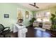 Home office featuring a glass desk, comfortable seating, and plenty of natural light from multiple windows at 1012 Catch Fly Ln, Durham, NC 27713