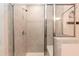 Contemporary shower with beige tiling, a glass enclosure, and a built-in seat at 1012 Catch Fly Ln, Durham, NC 27713