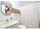 Bathroom featuring a vanity, toilet, and shower with decorative shower curtain at 103 Morningside Dr, Carrboro, NC 27510