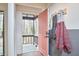 Entryway with a brick floor, coat rack, and view of the porch at 103 Morningside Dr, Carrboro, NC 27510