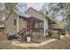 Charming home exterior with a back patio and landscaped yard at 103 Morningside Dr, Carrboro, NC 27510