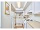 Bright kitchen with white cabinets and appliances at 103 Morningside Dr, Carrboro, NC 27510