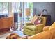 Inviting living room with a cozy chair, guitar, and natural light at 103 Morningside Dr, Carrboro, NC 27510