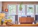 Comfortable living room featuring large windows and vintage furnishings at 103 Morningside Dr, Carrboro, NC 27510