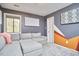Comfortable living room with a sectional sofa, window, and modern wall decor at 103 Morningside Dr, Carrboro, NC 27510