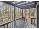 Outdoor patio with table and chairs, perfect for enjoying the surrounding wooded views at 103 Morningside Dr, Carrboro, NC 27510