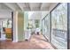 Sunroom area featuring a brick floor, skylight, and multiple plants at 103 Morningside Dr, Carrboro, NC 27510