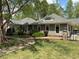 Inviting view of community clubhouse with well-maintained landscaping and picturesque walkway at 110 Bellamy Ln # 103, Chapel Hill, NC 27516