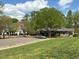 Scenic view of community buildings with a central pool and playground, surrounded by greenery at 110 Bellamy Ln # 109, Chapel Hill, NC 27516