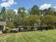 Community pool with a view of the landscaped common area, perfect for enjoying the outdoors at 110 Bellamy Ln # 206, Chapel Hill, NC 27516