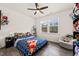 Bedroom with hardwood floors, bed with a pizza blanket and a chair in corner at 1121 White Oak Creek Dr, Apex, NC 27523