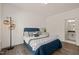 Bedroom with hardwood floors, nice lighting and comfortable bed at 1121 White Oak Creek Dr, Apex, NC 27523