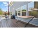 Spacious deck with modern furniture, including a hammock and egg chair at 1121 White Oak Creek Dr, Apex, NC 27523