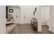 Welcoming entry with table decor, leading to a half bath for convenience at 1121 White Oak Creek Dr, Apex, NC 27523