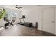 The workout room features a fan, a treadmill, stationary bike, and natural light at 1121 White Oak Creek Dr, Apex, NC 27523