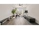 The workout room features a fan, a treadmill, stationary bike, and natural light at 1121 White Oak Creek Dr, Apex, NC 27523