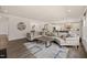 Spacious living room with modern decor, hardwood floors, and an open layout at 1121 White Oak Creek Dr, Apex, NC 27523