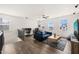 Living area features a ceiling fan, hardwood floors, and modern decor at 1121 White Oak Creek Dr, Apex, NC 27523