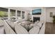 Cozy living room featuring a fireplace, large windows, and comfortable seating at 1121 White Oak Creek Dr, Apex, NC 27523