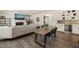 Inviting living space showcasing the flow into the dining area with wet bar and fireplace at 1121 White Oak Creek Dr, Apex, NC 27523