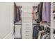 This organized walk-in closet features ample storage, hanging space and shelves for clothes and shoes at 1121 White Oak Creek Dr, Apex, NC 27523