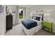 Comfortable bedroom with a cozy bed, decorative pillows, playful decor, and a view of the green outdoors at 1130 Winding Spring Dr, Mebane, NC 27302