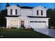 Charming two-story home featuring a white exterior, black shutters, and a well-manicured lawn at 1130 Winding Spring Dr, Mebane, NC 27302