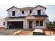 Exterior view of home under construction with Tyvek wrap and windows awaiting installation at 1130 Winding Spring Dr, Mebane, NC 27302