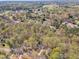 Wide aerial shot of a neighborhood surrounded by lush trees at 1133 Turner Farms Rd, Garner, NC 27529