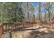 Outdoor wooden deck perfect for entertaining, surrounded by lush trees for privacy at 1133 Turner Farms Rd, Garner, NC 27529