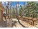 Wooden back deck surrounded by lush green trees, offering privacy and relaxation at 1133 Turner Farms Rd, Garner, NC 27529