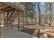View from covered patio showcasing backyard with natural landscape and mature trees at 1133 Turner Farms Rd, Garner, NC 27529