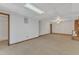 Basement space, with lots of square footage, and a doorway to another room at 1133 Turner Farms Rd, Garner, NC 27529