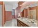 Bathroom offers a double vanity, large mirror, and walk-in shower at 1133 Turner Farms Rd, Garner, NC 27529