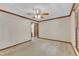 Large, carpeted bedroom features classic trim, ceiling fan, and sunny window at 1133 Turner Farms Rd, Garner, NC 27529