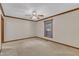 Bright, carpeted bedroom with a ceiling fan and window providing natural light at 1133 Turner Farms Rd, Garner, NC 27529