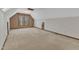 Spacious bonus room features neutral carpeting, a window nook, and a charming dormer ceiling at 1133 Turner Farms Rd, Garner, NC 27529