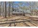 Charming brick home with inviting front porch surrounded by mature trees at 1133 Turner Farms Rd, Garner, NC 27529